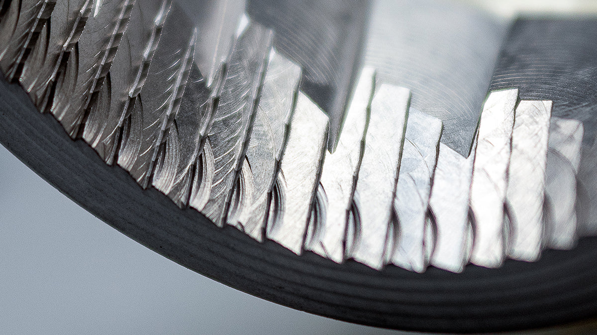 Extreme close-up photo of coffee grinder burrs.