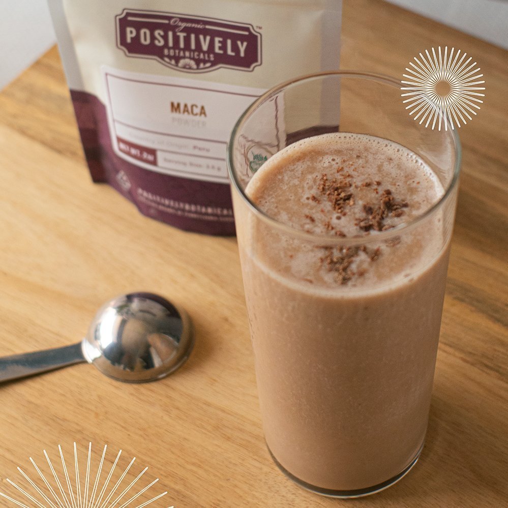 Positively Botanicals Organic Maca herbal supplement powder blended into a creamy smoothie for natural energy and wellness benefits.