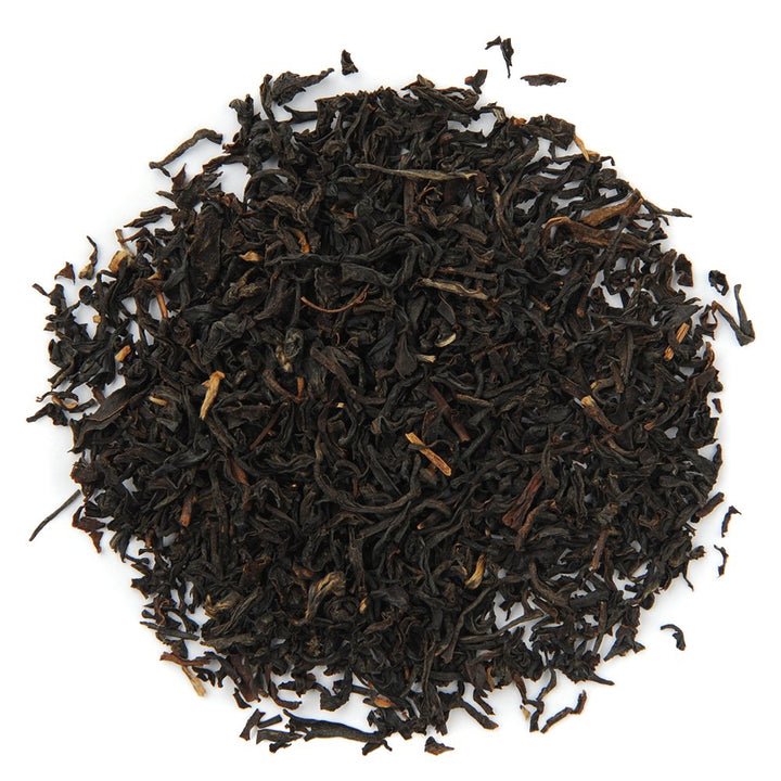 Organic Assam black tea loose leaves, rich and bold, offering sweet, smooth, and complex flavor notes.