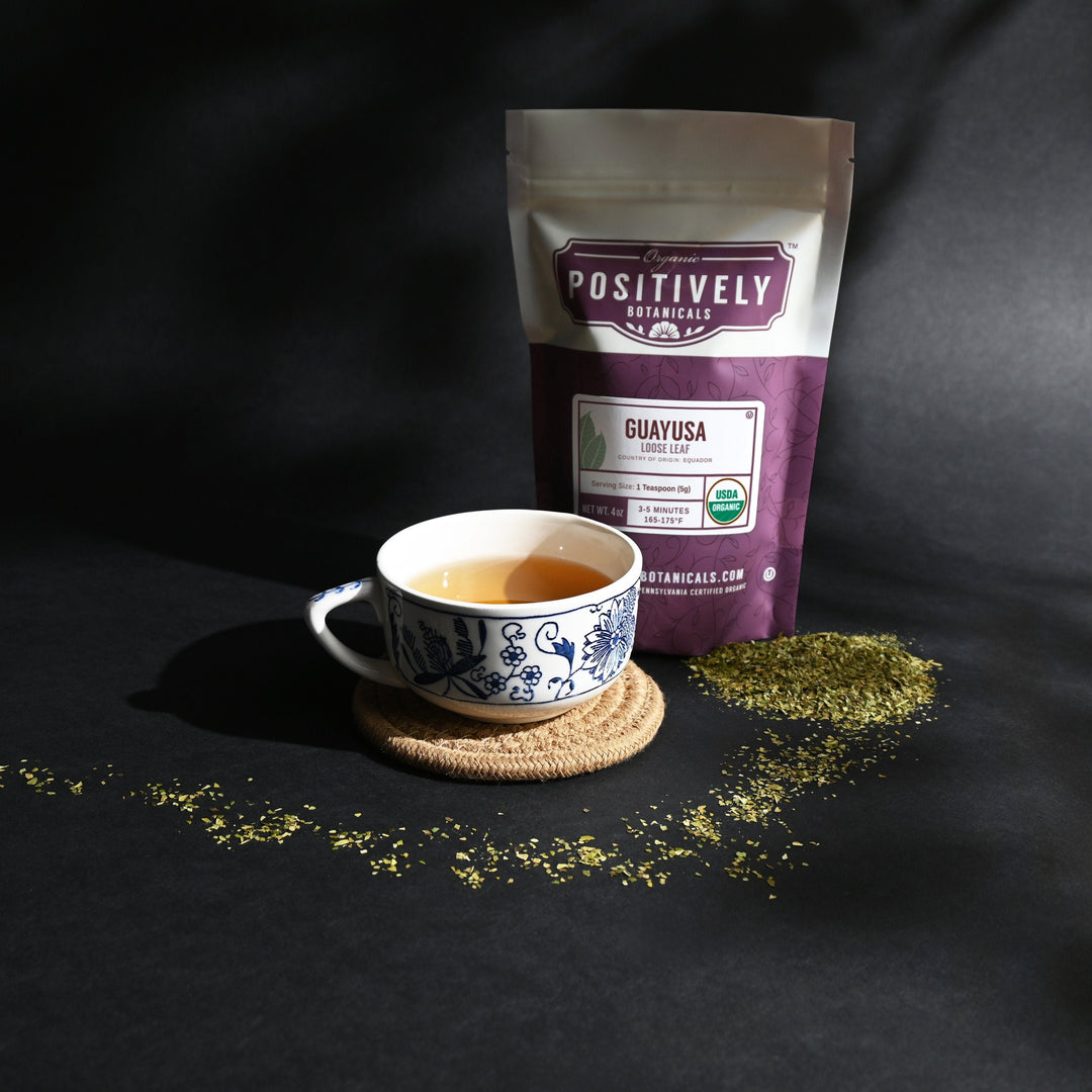 Positively Botanicals Organic Guayusa herbal supplement steeped in hot water, creating a smooth, naturally caffeinated drink.