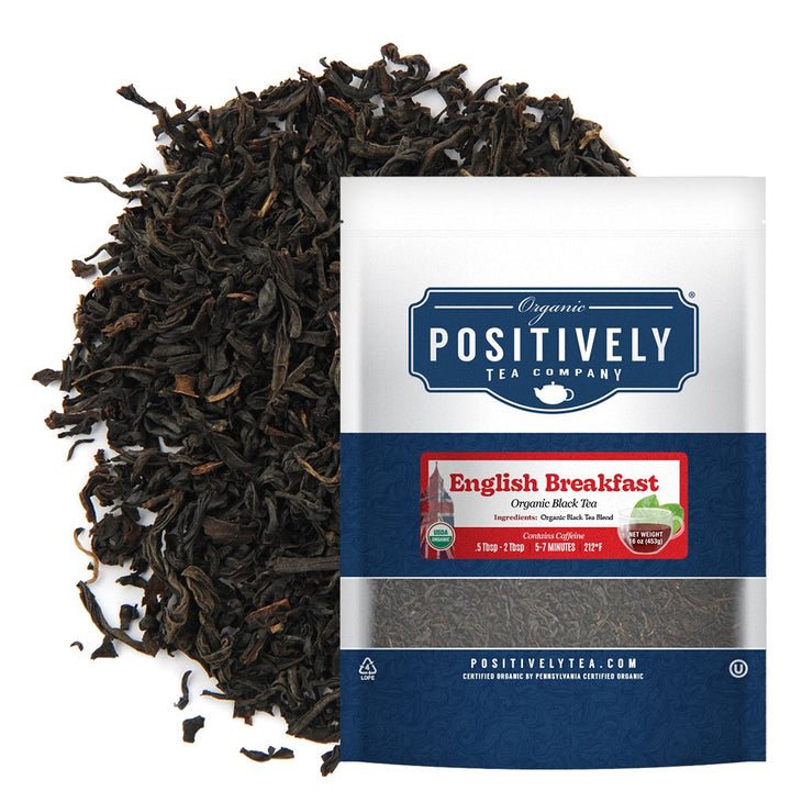Positively Tea Company English Breakfast Organic Black Tea, 16oz bag displayed with loose tea leaves, highlighting smooth and hearty flavor profile.