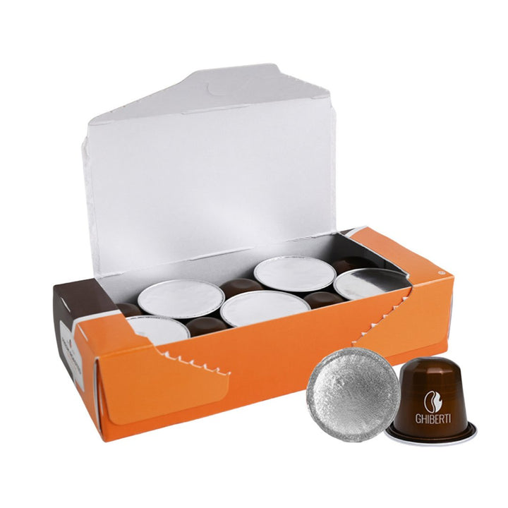 Ghiberti espresso capsules from Fresh Roasted Coffee being displayed in an open box, capturing the convenient single‑serve experience and full‑bodied Intensity 9 flavor profile with cocoa and fruit notes.