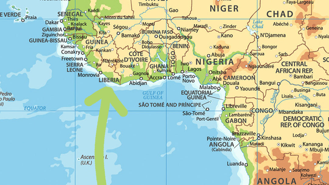 A world map with a green arrow pointing to Liberia.