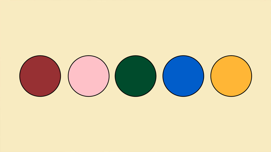 Five colored dots on a cream background.
