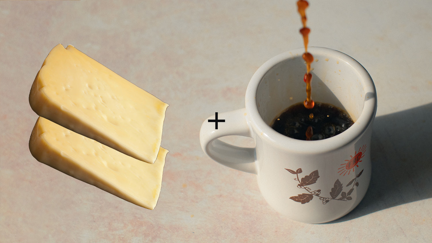 Two wedges of cheese and a coffee mug.