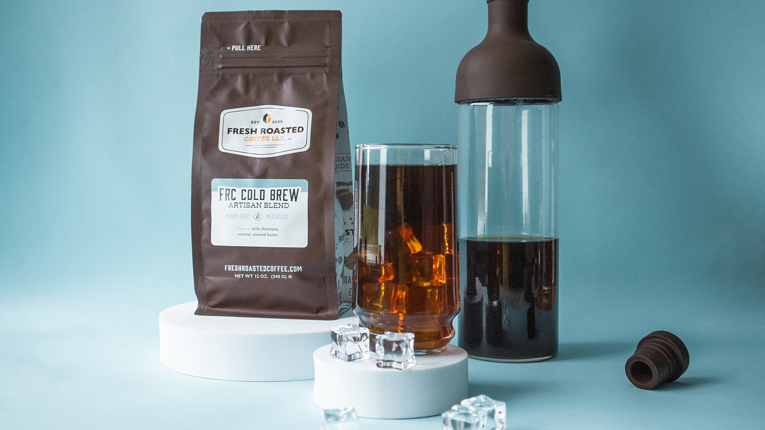 A bag of cold brew coffee, Hario Cold Brew Bottle, and a glass of cold brew.
