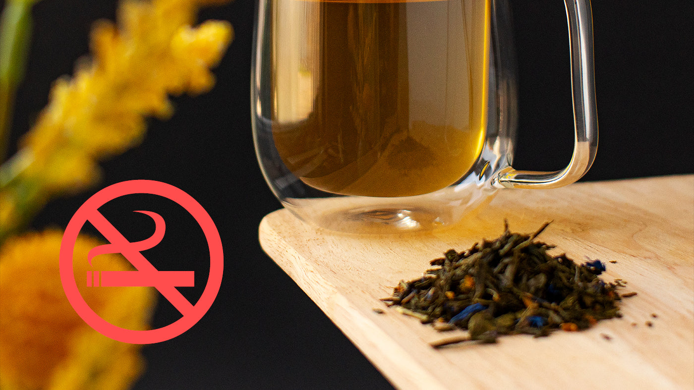 An image of sencha tea on a serving board in front of a brewed mug, with a no smoking symbol on the side.
