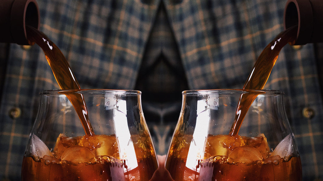 A mirrored image of cold brew being poured into an iced glass.
