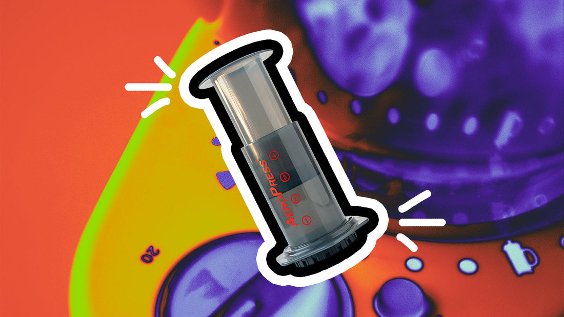 An AeroPress coffee brewer on top of an image of a coffee grinder.