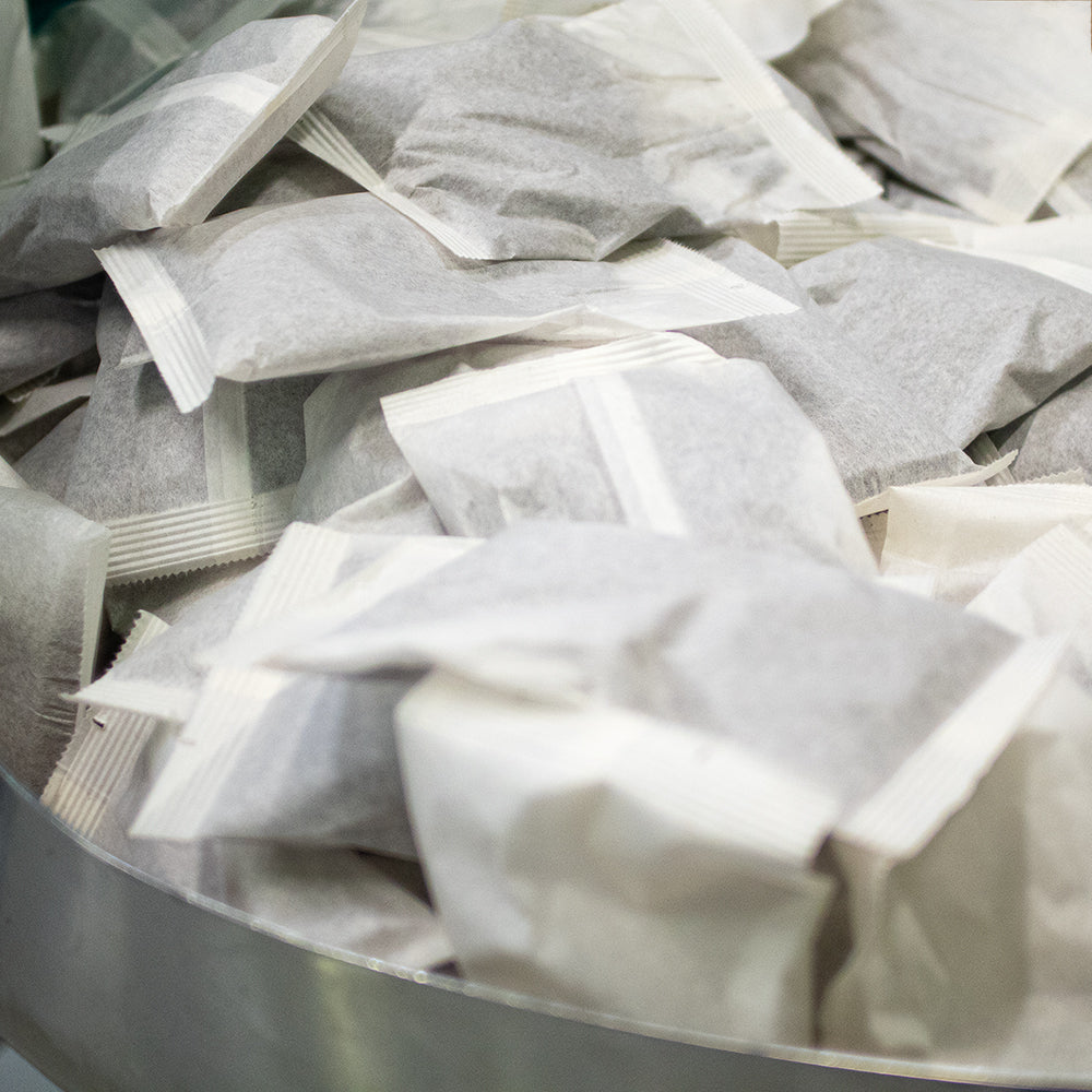 A pile of cold brew filter packs hot off the presses.