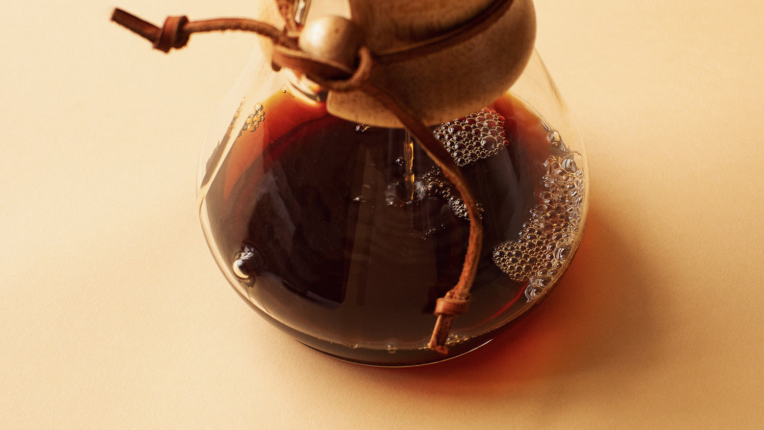 Coffee dripping from the filter into the Chemex's carafe.