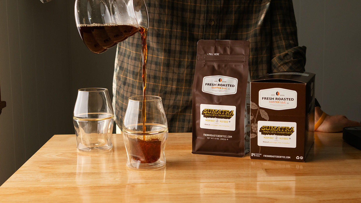 Fresh Roasted Coffee's Roaster's Choice Subscription featuring 12 oz bag and pods and two Avensi Vida Glasses