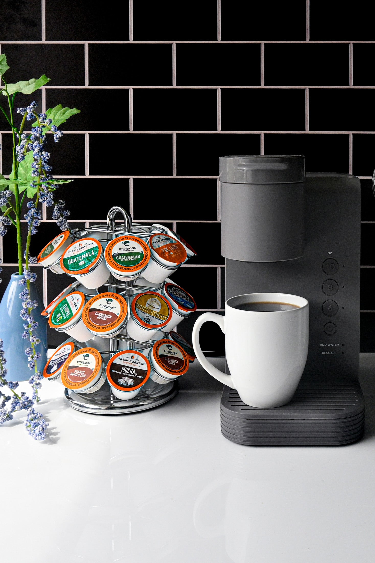 Image of coffee pod machine with cup of coffee.